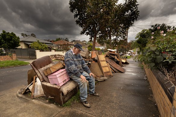 86-year-old Brian Matthews sits amongst the debris of the Maribyrnong home he has lived in his whole life, after it was inundated by floodwater last month.
