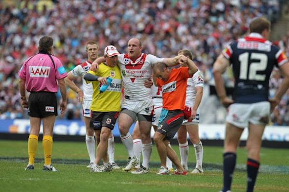 The Dragons Michael Weyman is injured during the first half.