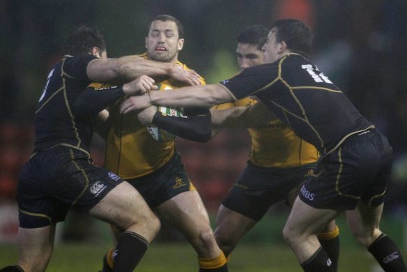 New Wallabies fullback Luke Morahan takes on the Scottish defence.