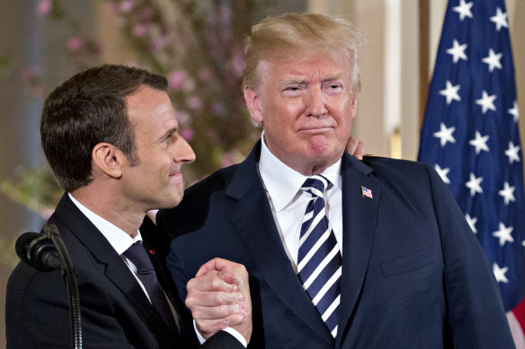 French President Emmanuel Macron, left, shows his affection for US President Donald Trump at a news conference in Washington.