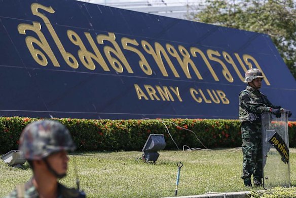 Thai soldiers stand guard as they provide security at the Army Club.