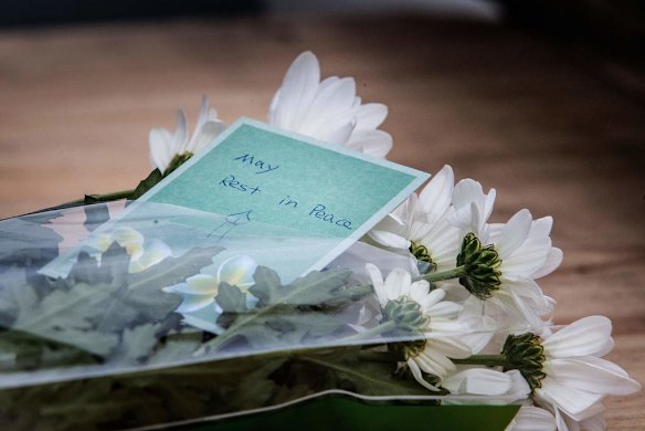 World AIDS Convention signage runs along the Princes Bridge and visitors have been leaving memorials in the form of messages and flowers since last night, on July 19, 2014 in Melbourne, Australia.