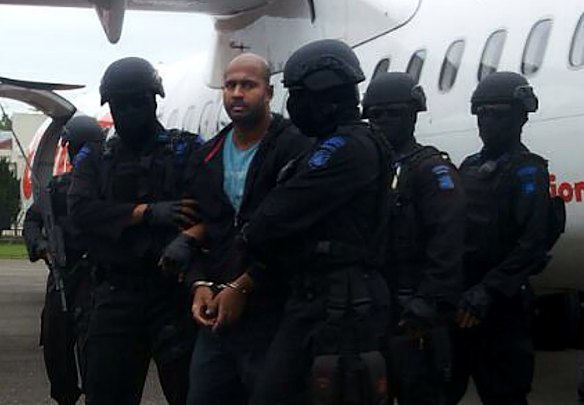 Myuran Sukumaran handcuffed arriving at Cilacap airport.