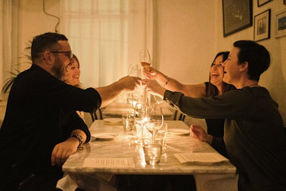 Cheers! Diners eat out on the first night of eased lockdown conditions in Enmore.
