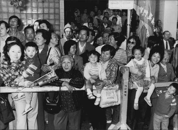 Crowds outside the Tai Yuen Palace Restaurant in Sussex Street await the arrival of the Premier. 