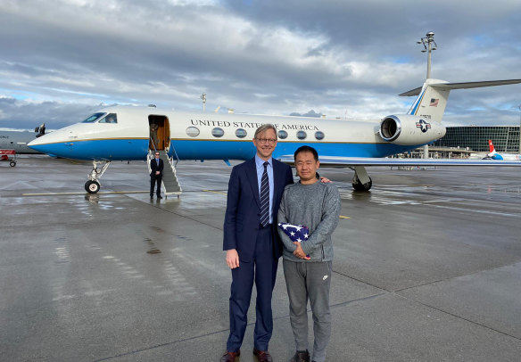 US special representative for Iran, Brian Hook, stands with Xiyue Wang in Zurich, Switzerland on Saturday