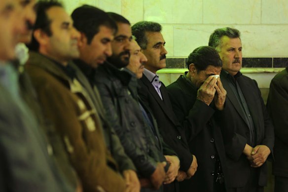 Male family members of killed asylum seeker Reza Barati during the memorial service.