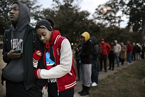 William Wright and India Johnson wait on line to vote in Norfolk Virginia