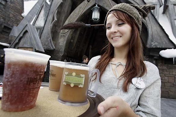 Erin Wuchte serves up Butterbeer to guests at The Wizarding World of Harry Potter at Universal Orlando theme park in Orlando, Florida.