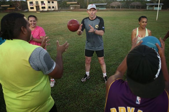 Prime Minister Tony Abbott doing physical training with members of the Bamaga community, during his visit to Cape York, on Friday 28 August 2015. 