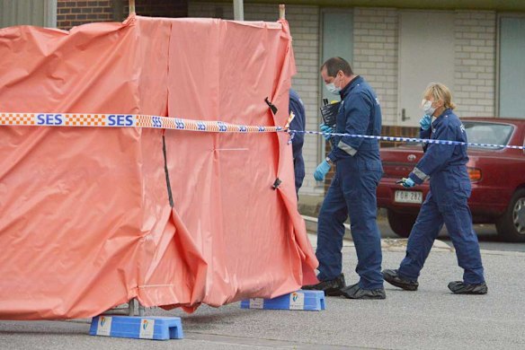 A canvas shields part of the scene where a terror suspect was shot dead.
