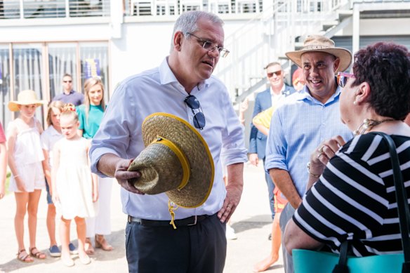 Open to ideas: Morrison talks with residents of Bribie Island at a community breakfast. 
