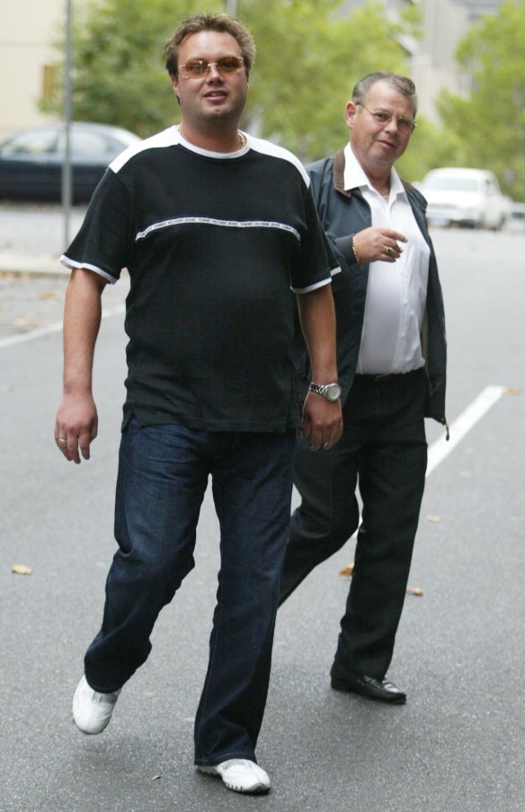 Carl Williams and his father George Williams leaving court after a bail hearing in 2004