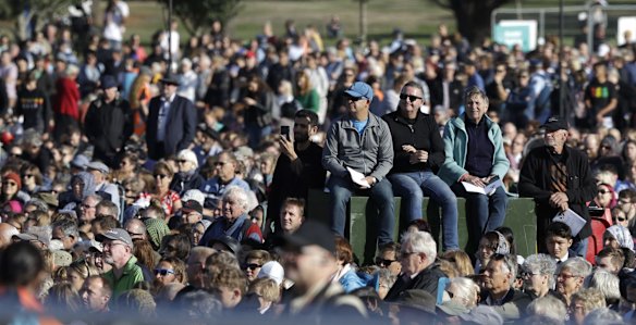 People listen during a National Remembrance Service in Hagley Park.