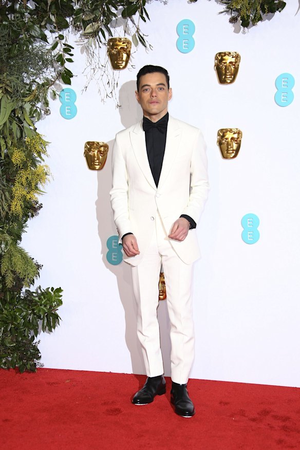 Bohemian Rhapsody actor Rami Malek poses for photographers upon arrival at the BAFTA awards in London.