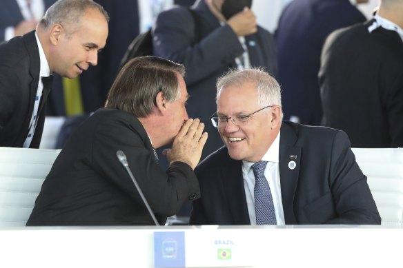 President of Brazil Jair Bolsonaro and Prime Minister Scott Morrison in discussion during the plenary session at the G20 Summit in Rome, on Saturday. 
