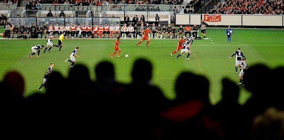 Fans watch the Melbourne Victory v Liverpool game.
