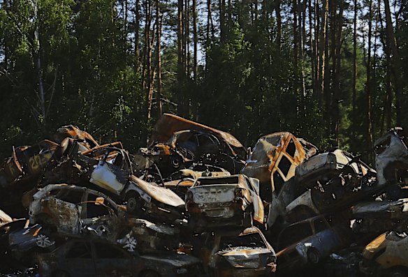 A wall of destroyed vehicles on the edge of a forest on a road from Kyiv to Bucha. More than 1300 civilians in Bucha and surrounding areas were killed by Russian soldiers when they occupied the town 30 kilometres north-west of Kyiv.
