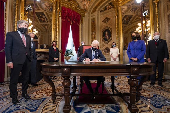 President Joe Biden signs three documents including an inauguration declaration, cabinet nominations and sub-cabinet nominations in the President's Room at the US Capitol after the inauguration ceremony, Wednesday, Jan. 20, 2021, at the U.S. Capitol in Washington.