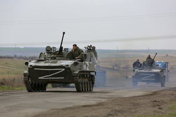 Russian military vehicles move on a highway in an area controlled by Russian-backed separatist forces near Mariupol. Mariupol, a strategic port on the Sea of Azov, has been besieged by Russian troops and forces from self-proclaimed separatist areas in eastern Ukraine for more than six weeks.