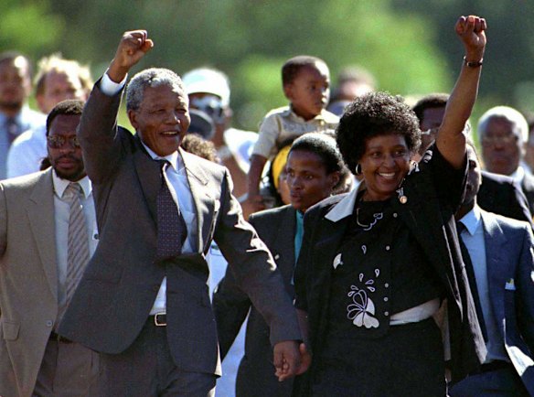 Mandela is accompanied by his former wife Winnie, moments after his release from prison,February 11, 1990.  KM/