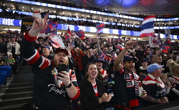The crowd cheer the action from the Rabbitohs v Roosters game.