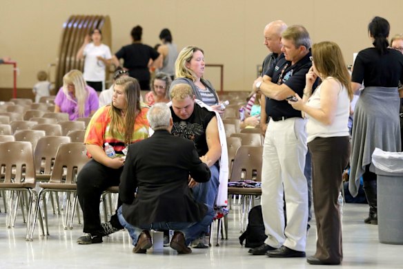 Friends and family are reunited with students at the local fairgrounds after a deadly shooting at Umpqua Community College, in Roseburg, Oregon.