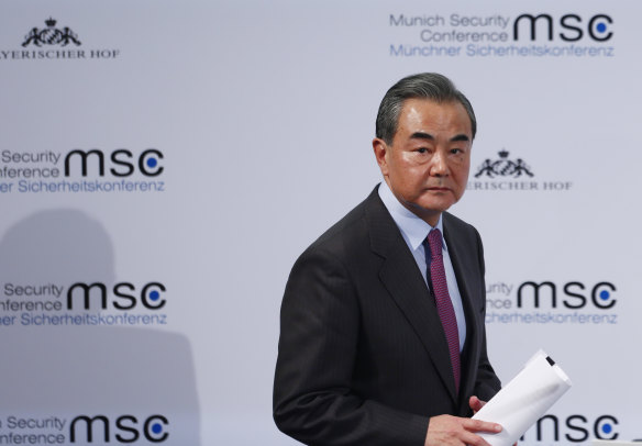 Wang Yi, China's foreign minister, leaves the stage during the Munich Security Conference.