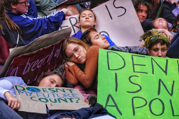Protesters take part in the Climate Emergency XR Snap Rally in Melbourne.