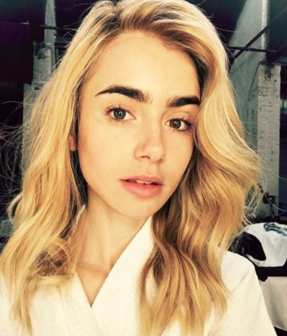 Lily Collins swapped dark brunette for fresh blonde, wavy locks in an Instagram debut. The actress captioned the image "Not sure if it's the blonde or this city, but I really am having more fun..." 