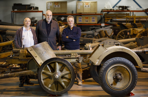 Producer John De Margheriti, director Phillip Noyce, and screenwriter John Collee with a PaK 38 5cm anti-tank gun at the Australian War Memorial Treloar facility where they were conducting research for a film about the Rats of Tobruk. 