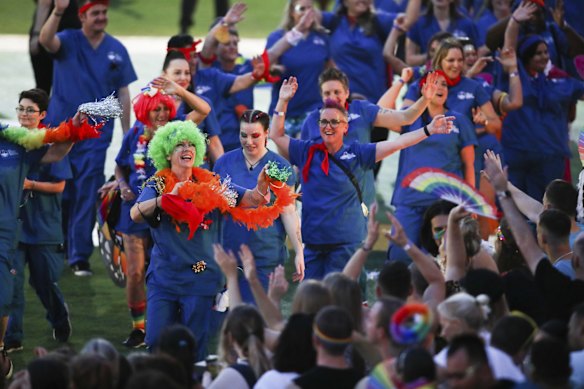 Participants and crowd alike are seen celebrating at the 2022 Mardi Gras parade at the Sydney Cricket Ground. 