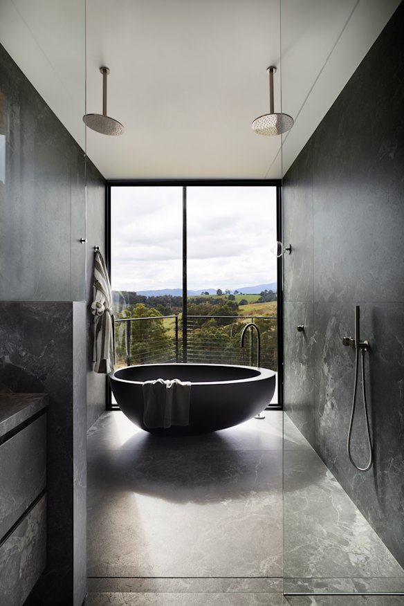 “We started the bathroom design with Stone Ambassador porcelain in ‘Hermes
Grey’, as the moody tones draw the eye to the view beyond,” says Tibballs.