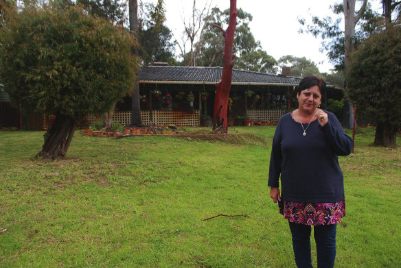 Eva Ricci outside her old home in Wattleup. She moved from the home 11 years ago, and she observed members of her own family and many neighbours suffer with their health.