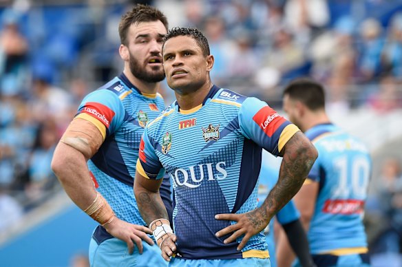 Josh Hoffman of the Titans looks on.