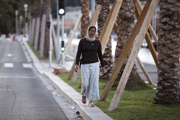 A woman cries asking for her son as she walk near the scene of the attack.