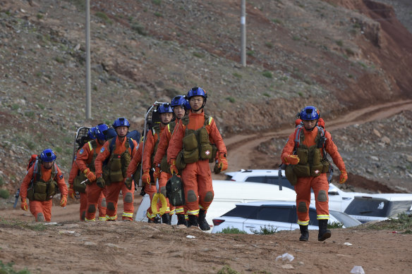 Rescuers walk into the accident site to search for survivors in Jingtai County of Baiyin City, northwest China’s Gansu Province.
