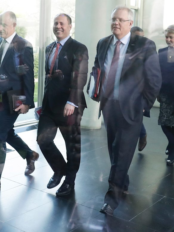 Minister for Environment and Energy Josh Frydenberg and Treasurer Scott Morrison depart the partyroom meeting after a leadership spill.