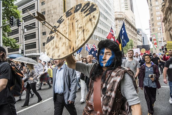 A protestor joins the World Wide Rally for Freedom March, in Sydney, against vaccine mandates and various other COVID related health orders.