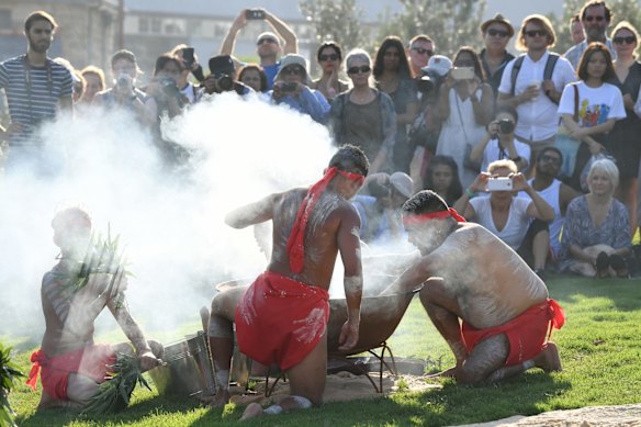 Koomurri dancers perform a smoking ceremony during the Australia Day Wugulora Morning Ceremony.