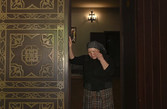 Nadiya Kuksenko, 65, who runs the St Andrew's Church shop in Bucha, weeps as she talks of the pain they have suffered. For Nadiya, the hardest part now is collecting the prayer messages residents write at the church, as she takes on the pain of each prayer.