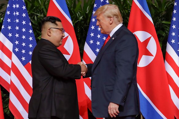 U.S. President Donald Trump shakes hands with North Korea leader Kim Jong Un at the Capella resort on Sentosa Island in Singapore.
