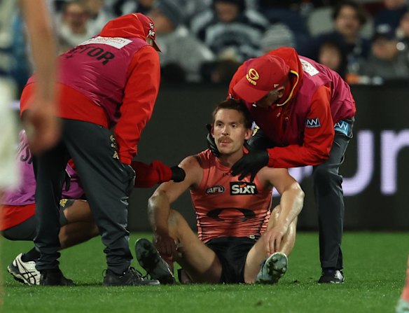 Heavy hit: Noah Anderson is attended to after he was crunched by star Cat Tom Stewart.