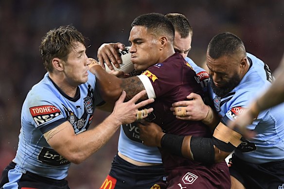 Joe Ofahengaue of the Maroons is tackled during game one of the 2021 State of Origin series.