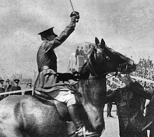 Police officers rush to seize Captain Francis De Groot immediately after he had cut the ribbon.  De Groot, a former cavalry officer, spurred his old racehorse from behind a line of NSW Lancers and slashed the ribbon before Jack Lang, the then Premier, could declare the bridge open.