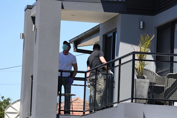 NSW Police forensic officers at the house in Merrylands. 