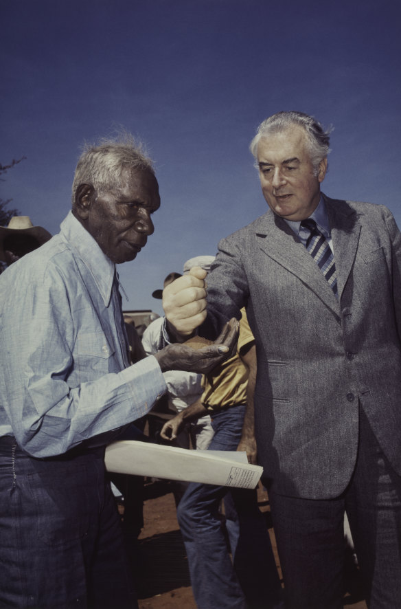 Prime Minister Gough Whitlam pours soil into the  hand of traditional landowner Vincent Lingiari, Northern Territory in 1975.