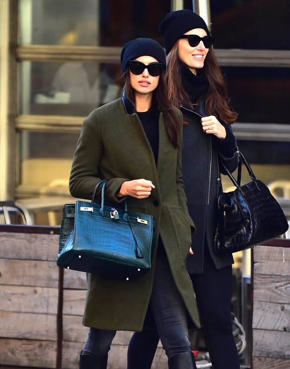 A little leather goes a long way to toughen a cardigan, as model Irina Shayk (left) shows.