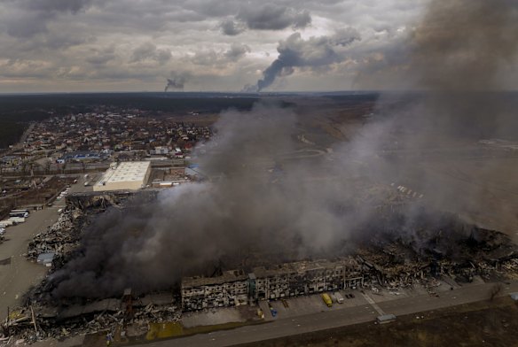 A factory and store burn after bombardment in Irpin, in the outskirts of Kyiv.