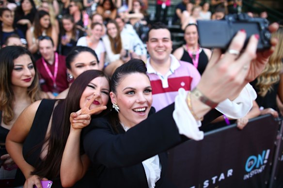 X Factor runner up Louise Adams takes a selfie with fans.